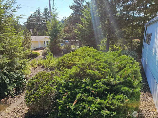 a front view of a house with a yard and a garage