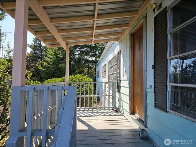 a kitchen with a sink a refrigerator and cabinets
