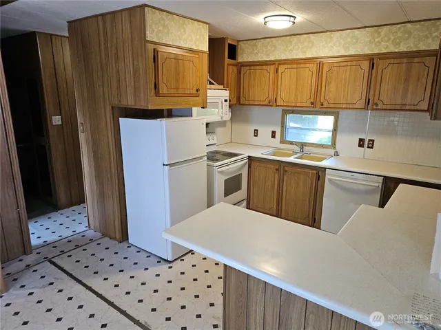 a living room with a chair and a window