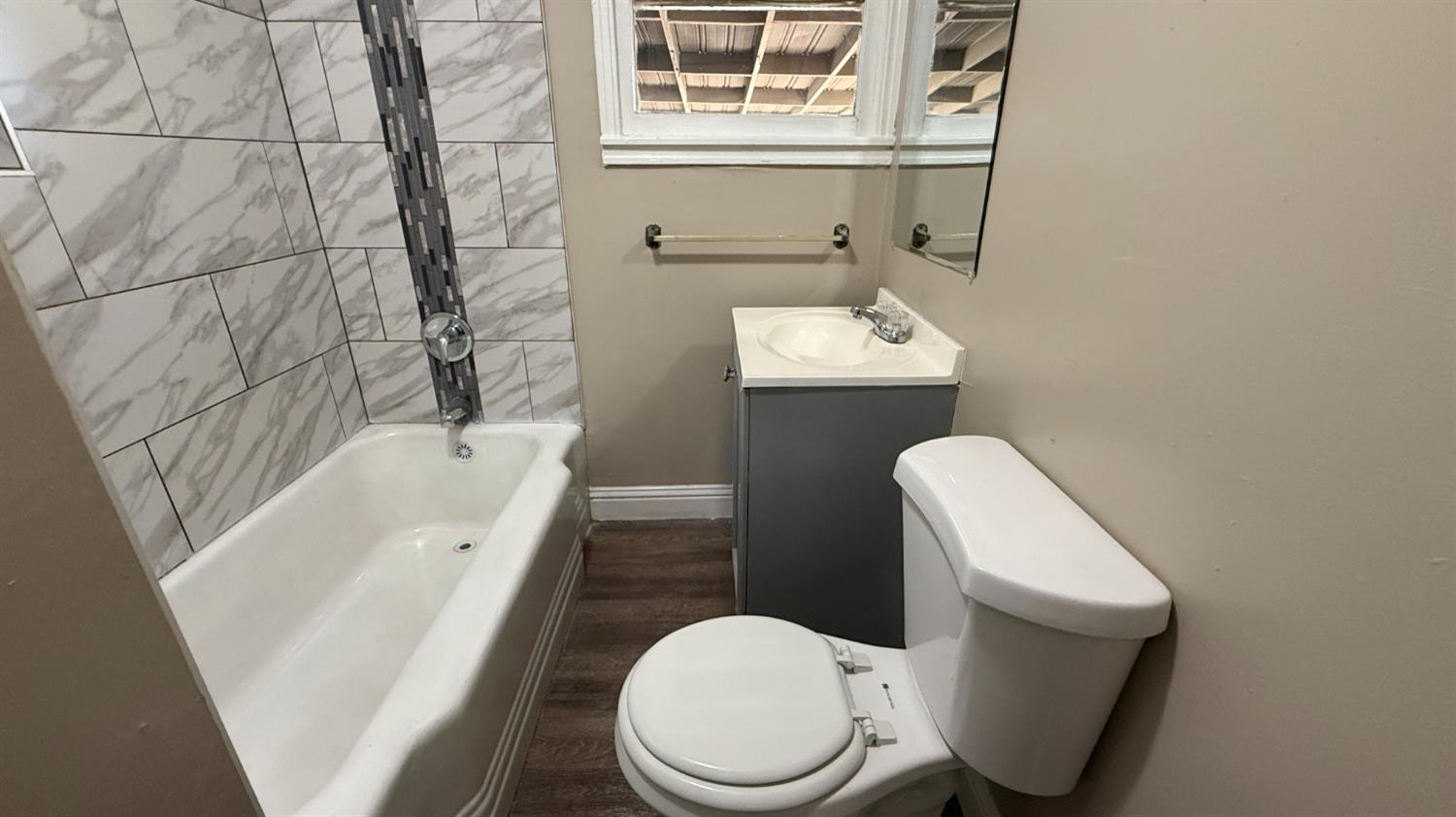 720 East Pleasant Street Coalinga, CA 93210 - Photo 11 of 18 a white toilet sitting next to a bathroom sink