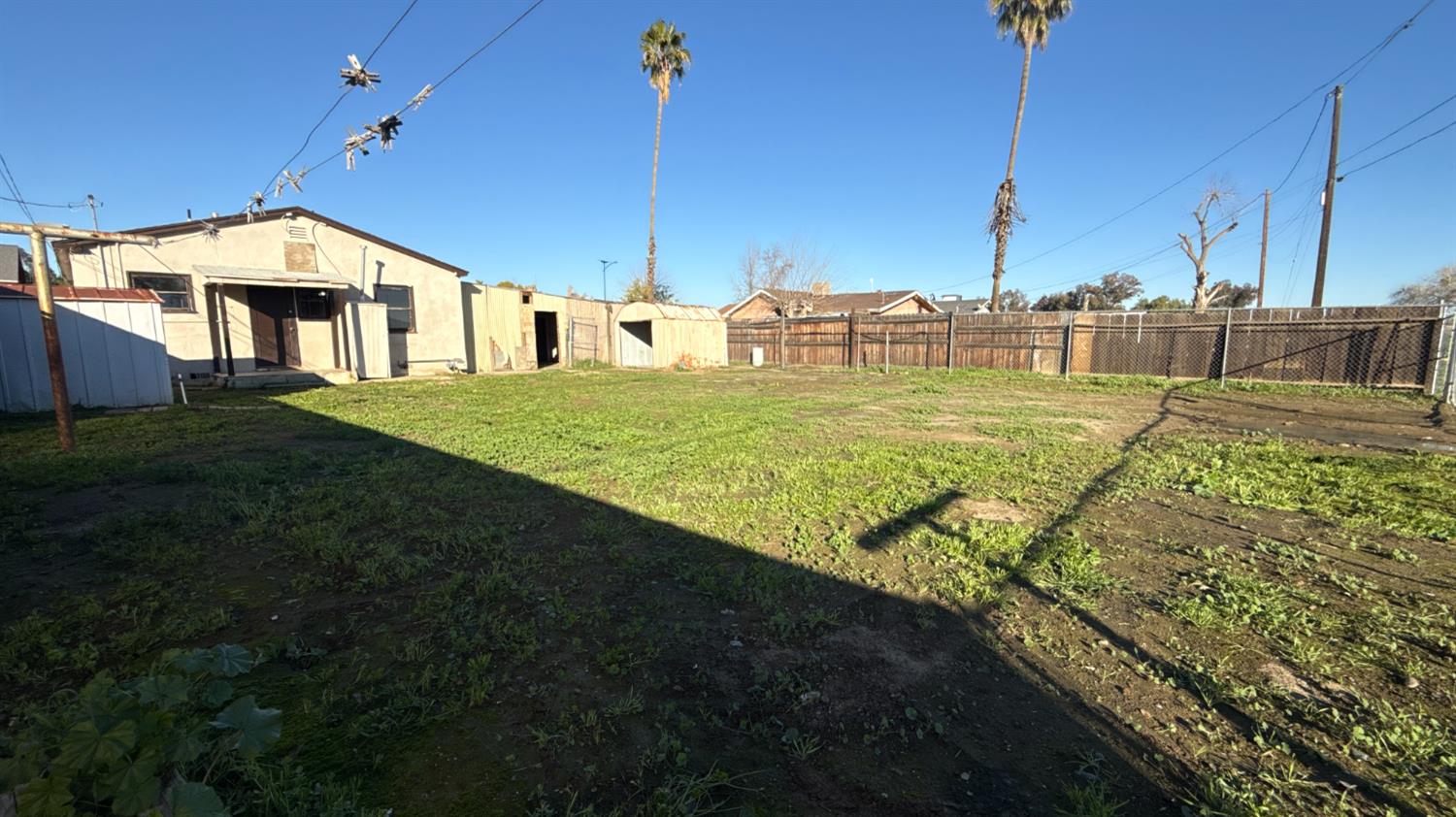 720 East Pleasant Street Coalinga, CA 93210 - Photo 16 of 18 a view of a house with a yard