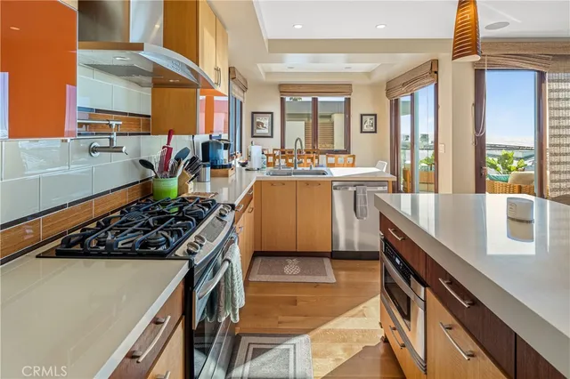 a kitchen with stove and cabinets
