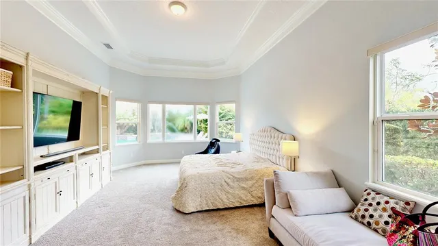 a spacious bathroom with a double vanity sink a large mirror a shower and a bathtub