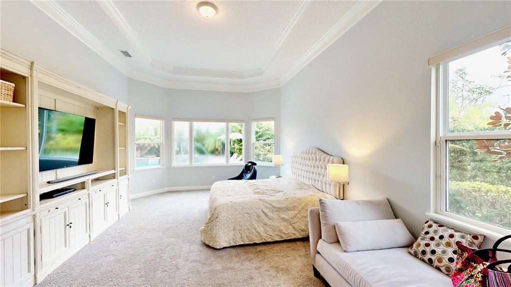 6219 Tiroco Way Windermere, FL 34786 - Photo 11 of 72 a living room with furniture and a flat screen tv