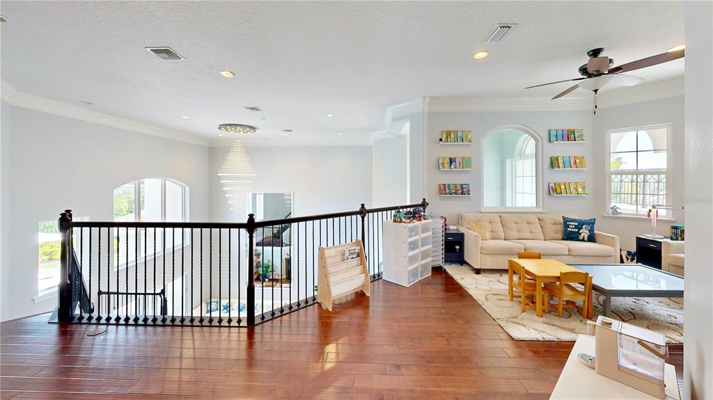 6219 Tiroco Way Windermere, FL 34786 - Photo 15 of 72 a very nice looking living room with wooden floor and a window
