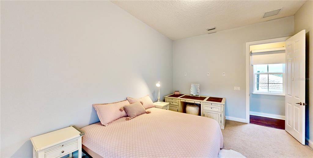 6219 Tiroco Way Windermere, FL 34786 - Photo 18 of 72 a bed room with a bed and a window