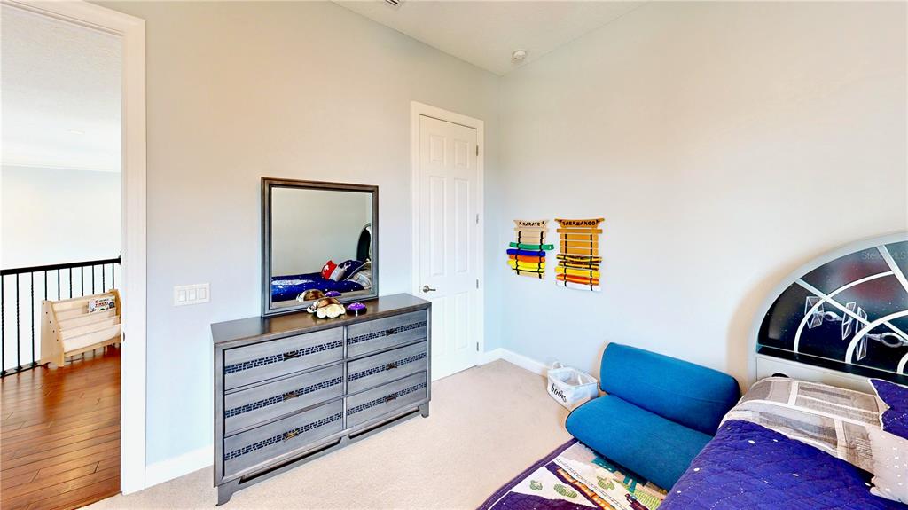 6219 Tiroco Way Windermere, FL 34786 - Photo 19 of 72 a room with furniture and wooden floor