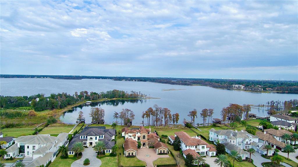 6219 Tiroco Way Windermere, FL 34786 - Photo 25 of 72 a view of a lake with a mountain in the back