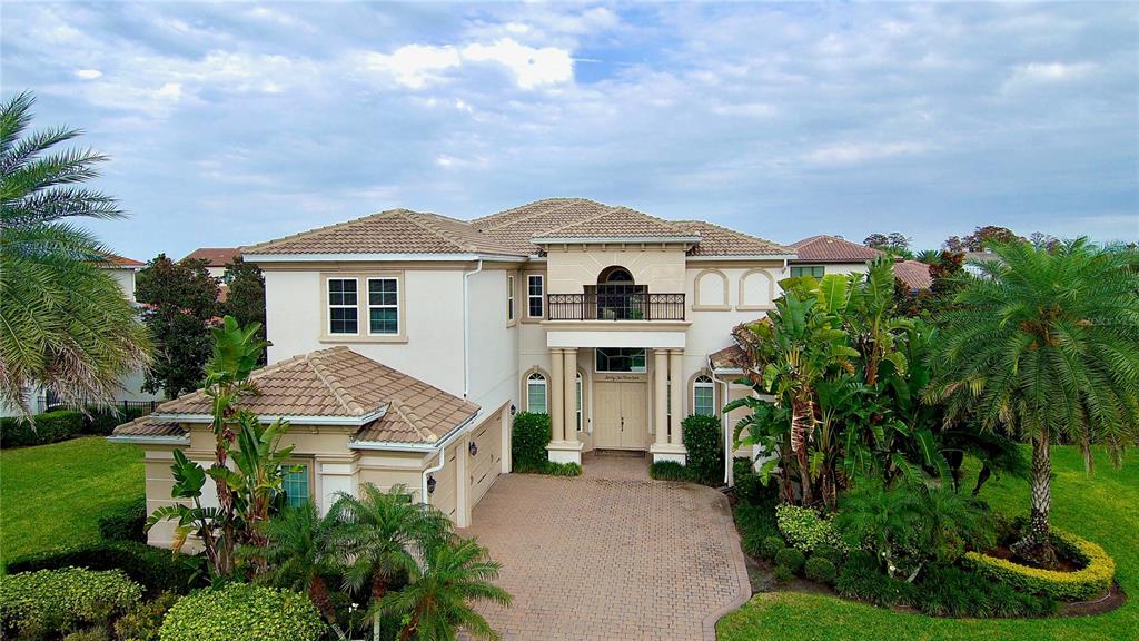 6219 Tiroco Way Windermere, FL 34786 - Photo 27 of 72 a front view of a house with a garden