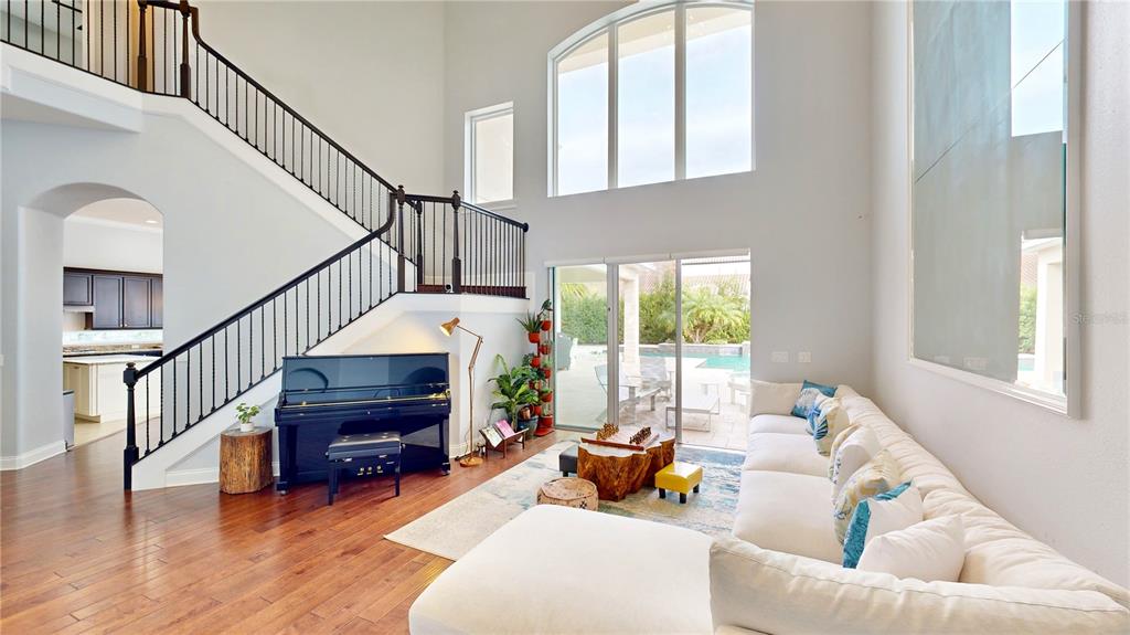 6219 Tiroco Way Windermere, FL 34786 - Photo 29 of 72 a living room with furniture and a fireplace