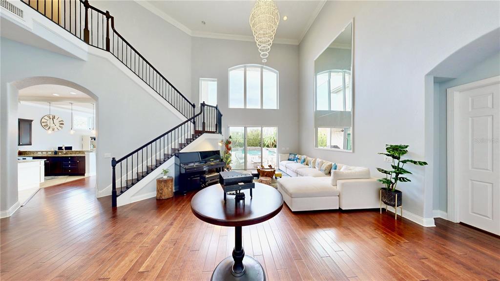 6219 Tiroco Way Windermere, FL 34786 - Photo 3 of 72 a living room with furniture and a wooden floor