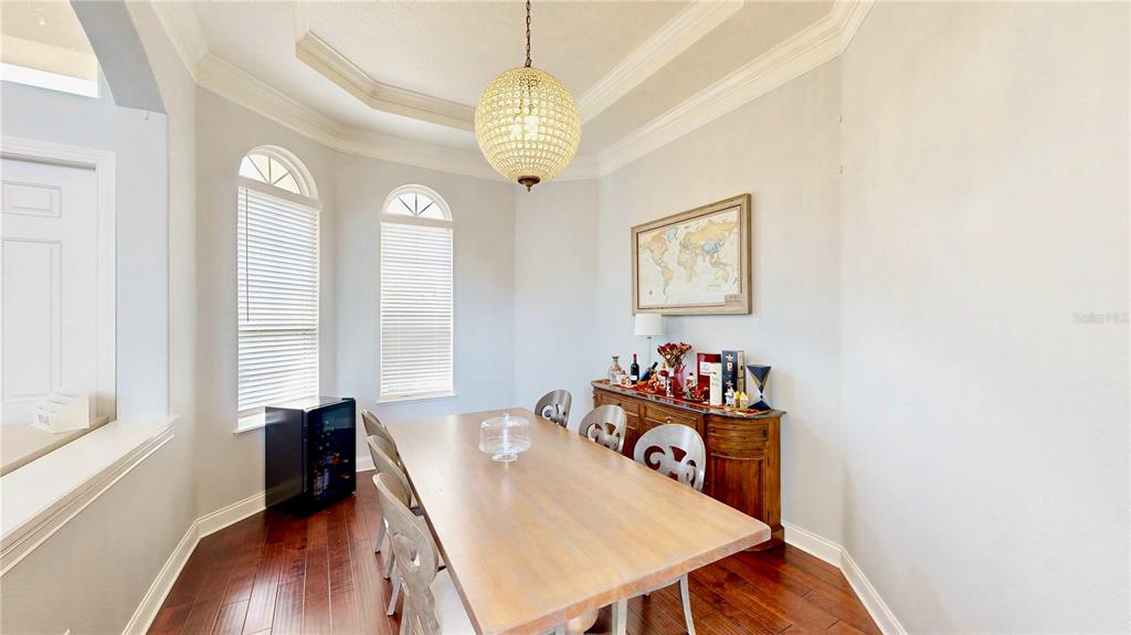 6219 Tiroco Way Windermere, FL 34786 - Photo 31 of 72 a view of a dining room with furniture and wooden floor