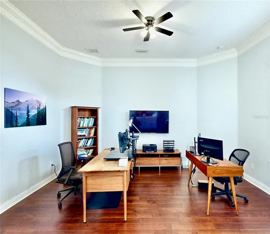 a bedroom with furniture and flat screen tv