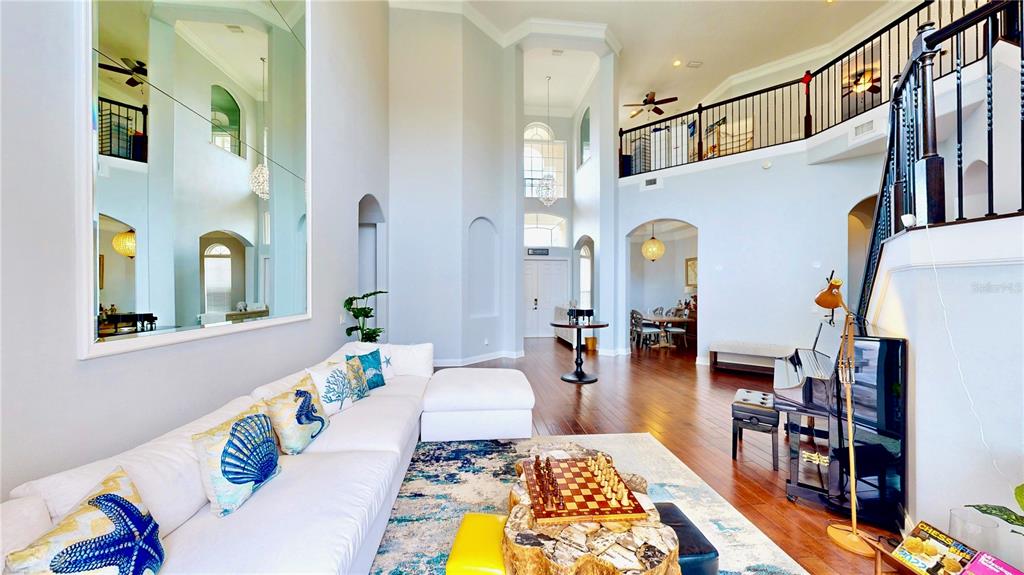 6219 Tiroco Way Windermere, FL 34786 - Photo 4 of 72 a living room with patio furniture and a fireplace