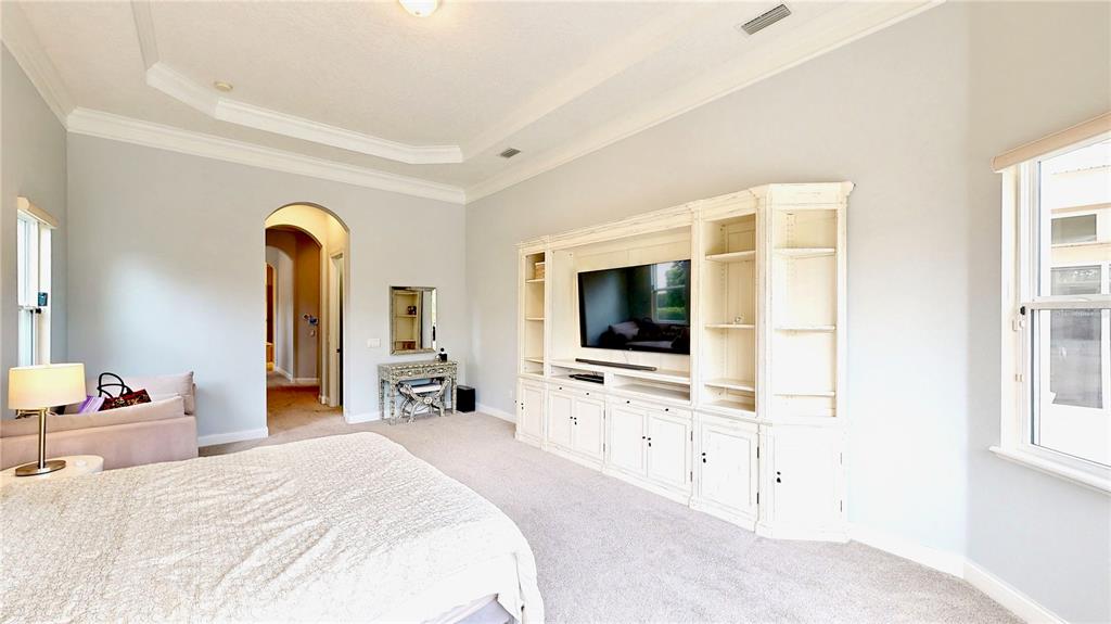 6219 Tiroco Way Windermere, FL 34786 - Photo 41 of 72 a bedroom with furniture and flat screen tv