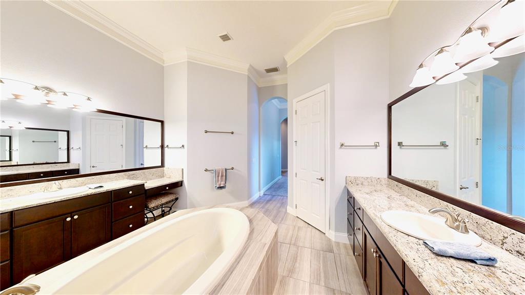 6219 Tiroco Way Windermere, FL 34786 - Photo 46 of 72 a spacious bathroom with a double vanity sink and a mirror