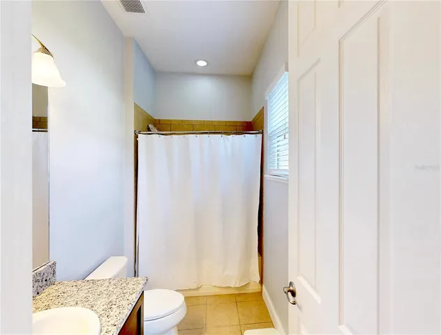 a view of a swimming pool with a yard