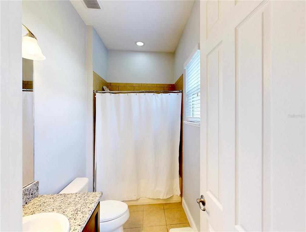 6219 Tiroco Way Windermere, FL 34786 - Photo 49 of 72 a bathroom with a sink and a mirror