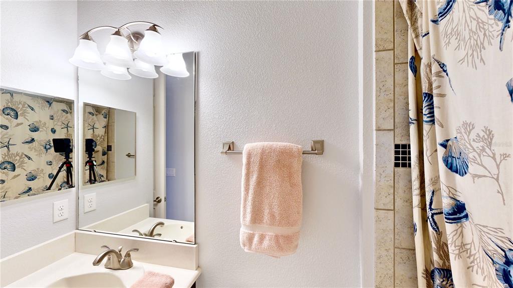 6219 Tiroco Way Windermere, FL 34786 - Photo 57 of 72 a bathroom with a sink vanity and mirror