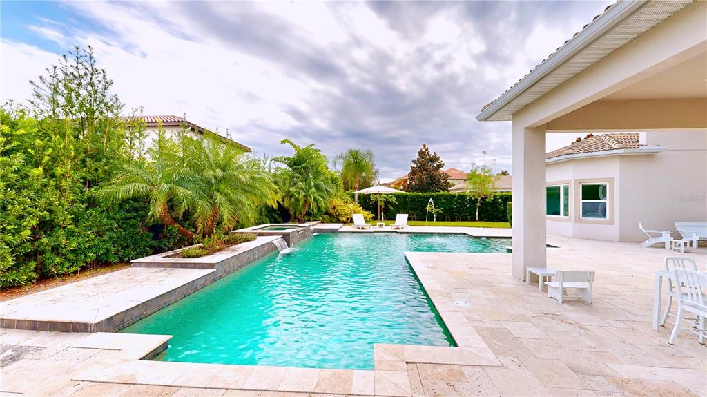 6219 Tiroco Way Windermere, FL 34786 - Photo 65 of 72 a view of swimming pool with lawn chairs and plants