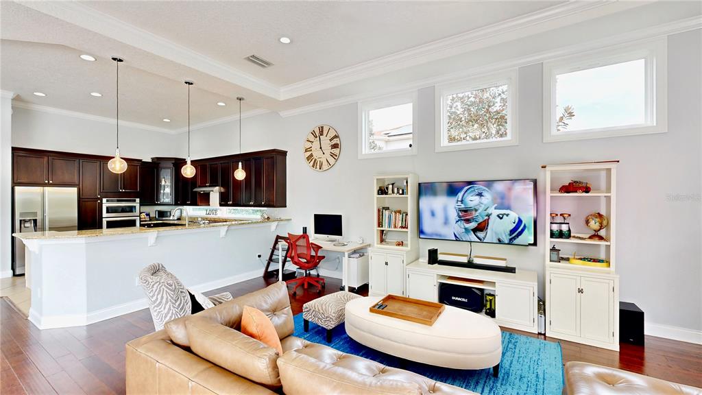 6219 Tiroco Way Windermere, FL 34786 - Photo 8 of 72 a living room with furniture and kitchen view