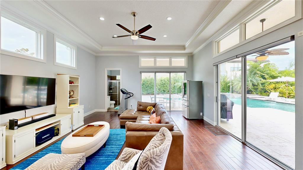 6219 Tiroco Way Windermere, FL 34786 - Photo 9 of 72 a living room with furniture and a flat screen tv