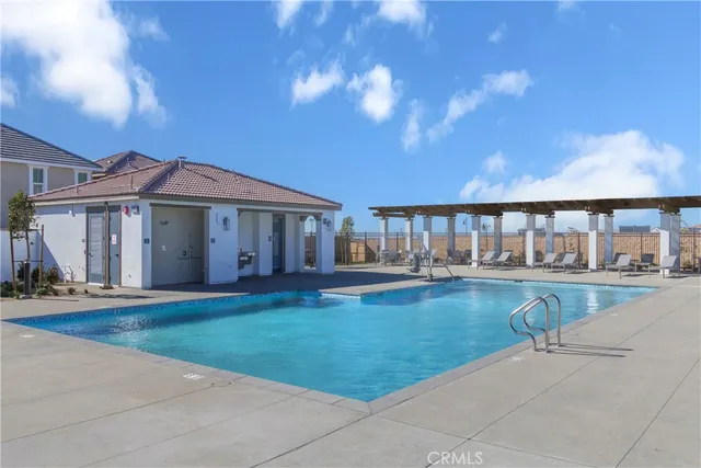 a view of swimming pool and outdoor seating