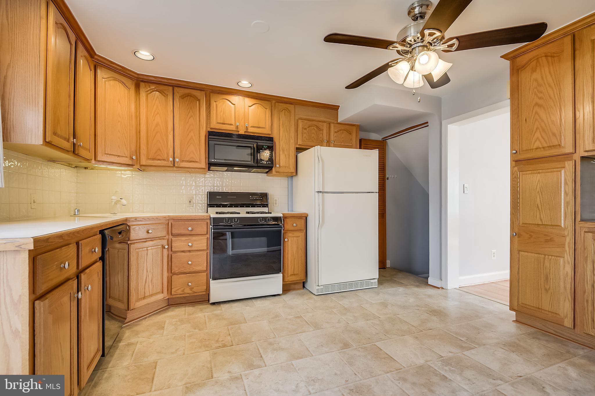 1622 Myamby Road Baltimore, MD 21286 - Photo 8 of 28 a kitchen with stainless steel appliances granite countertop a refrigerator a stove top oven a sink and dishwasher