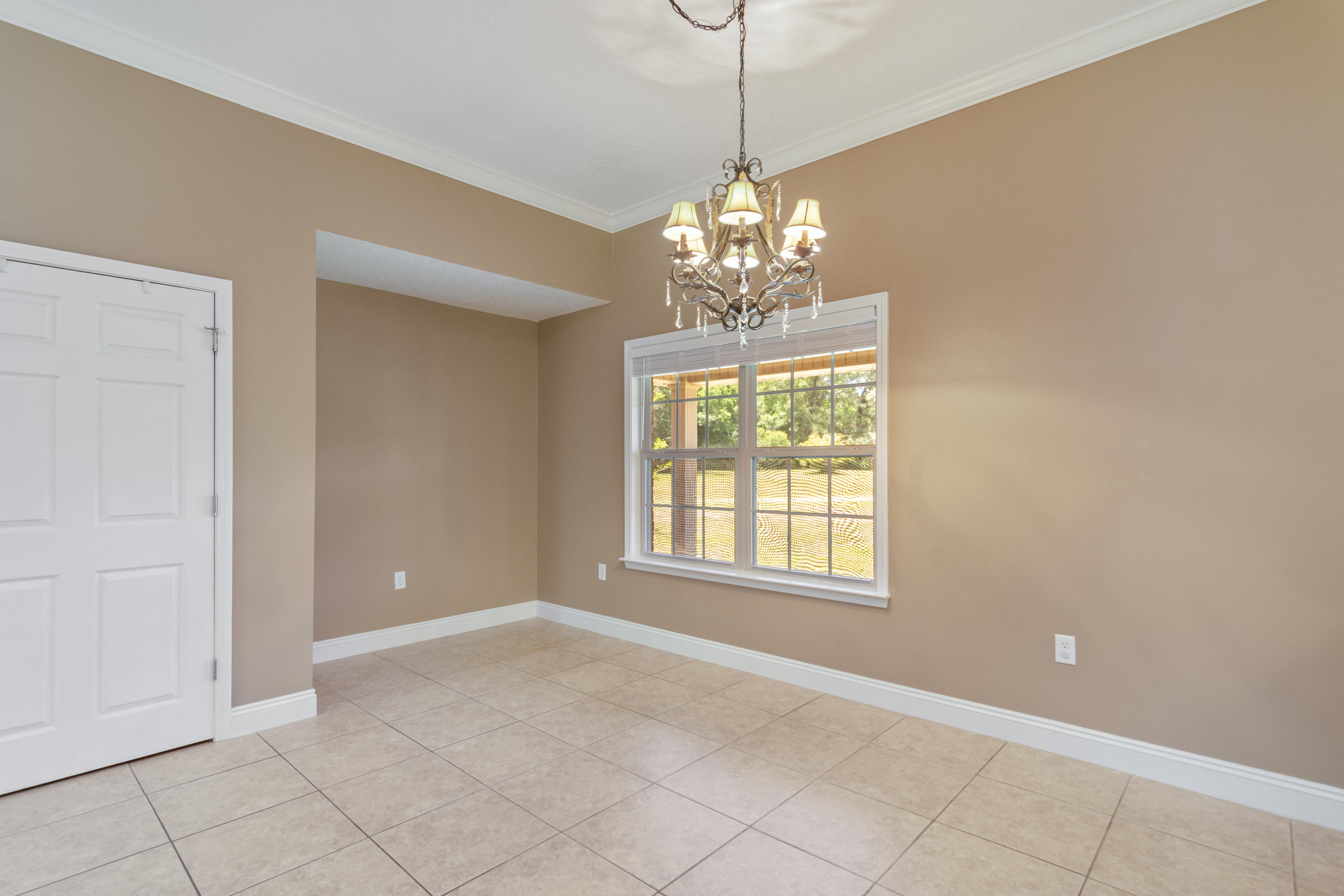 6589 Old River Road Baker, FL 32531 - Photo 15 of 49 a view of an empty room with windows