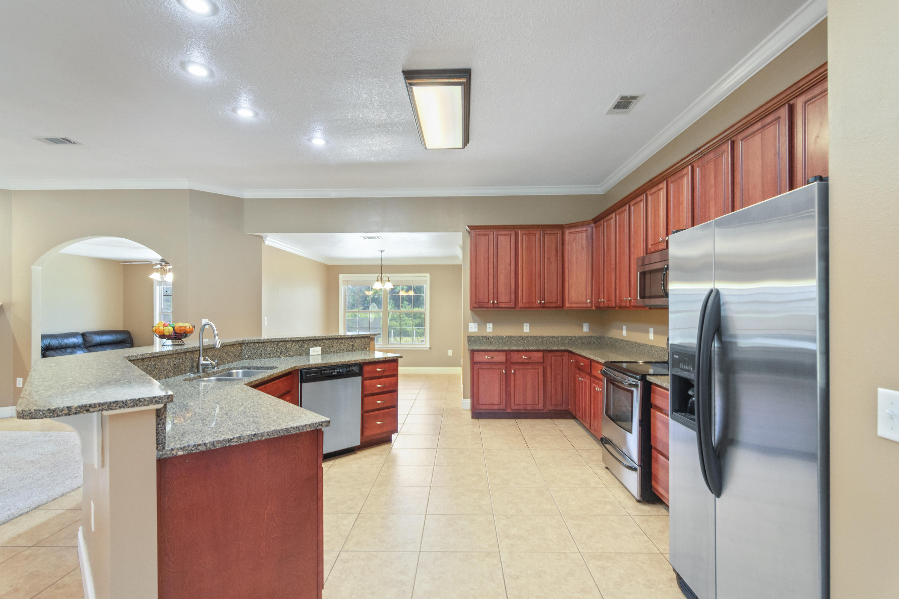 6589 Old River Road Baker, FL 32531 - Photo 16 of 49 a kitchen with a refrigerator sink and stove