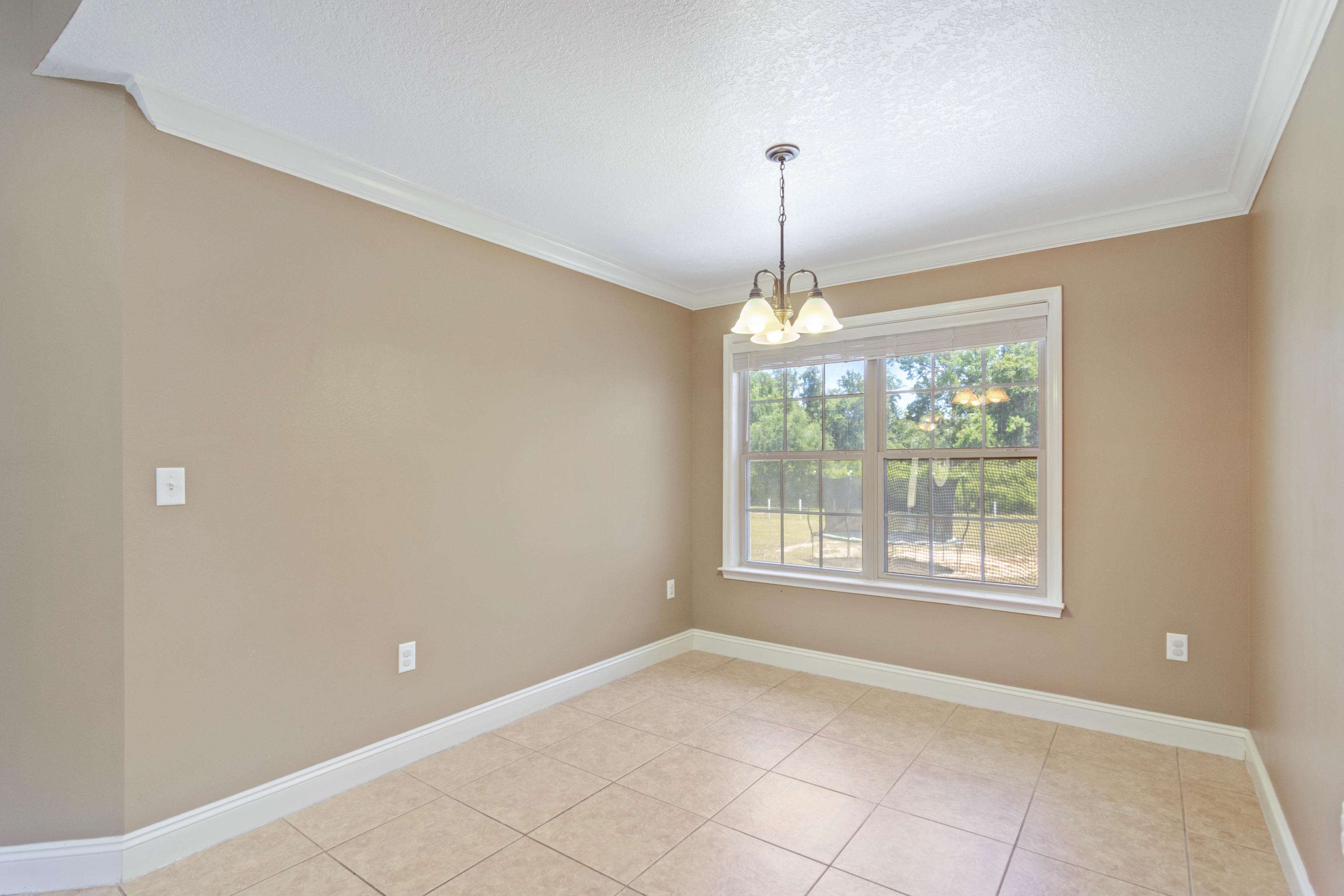 6589 Old River Road Baker, FL 32531 - Photo 21 of 49 a view of an empty room with window