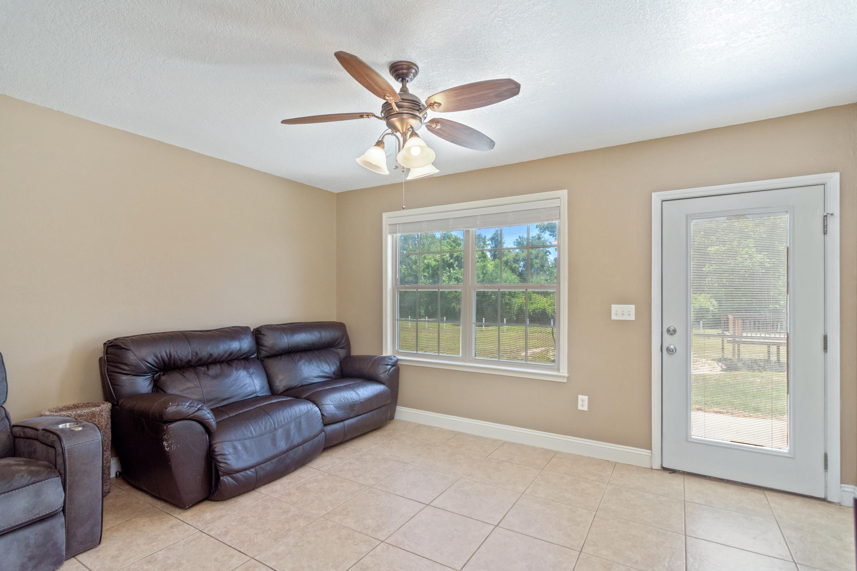 6589 Old River Road Baker, FL 32531 - Photo 22 of 49 a living room with furniture and a window