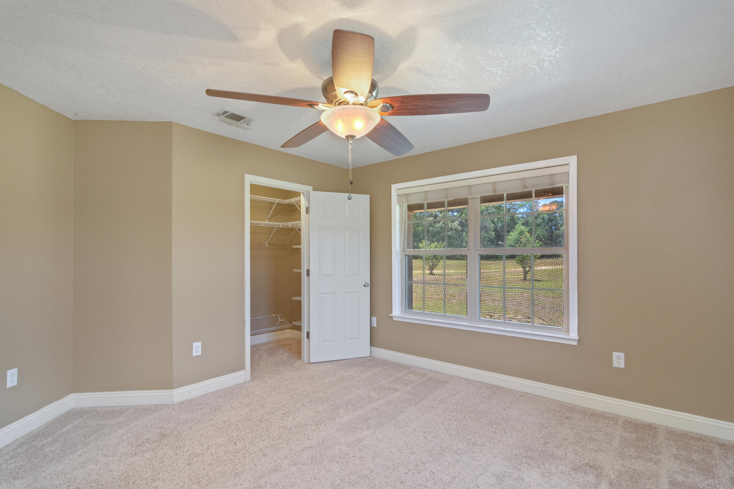 6589 Old River Road Baker, FL 32531 - Photo 23 of 49 a view of an empty room with a window