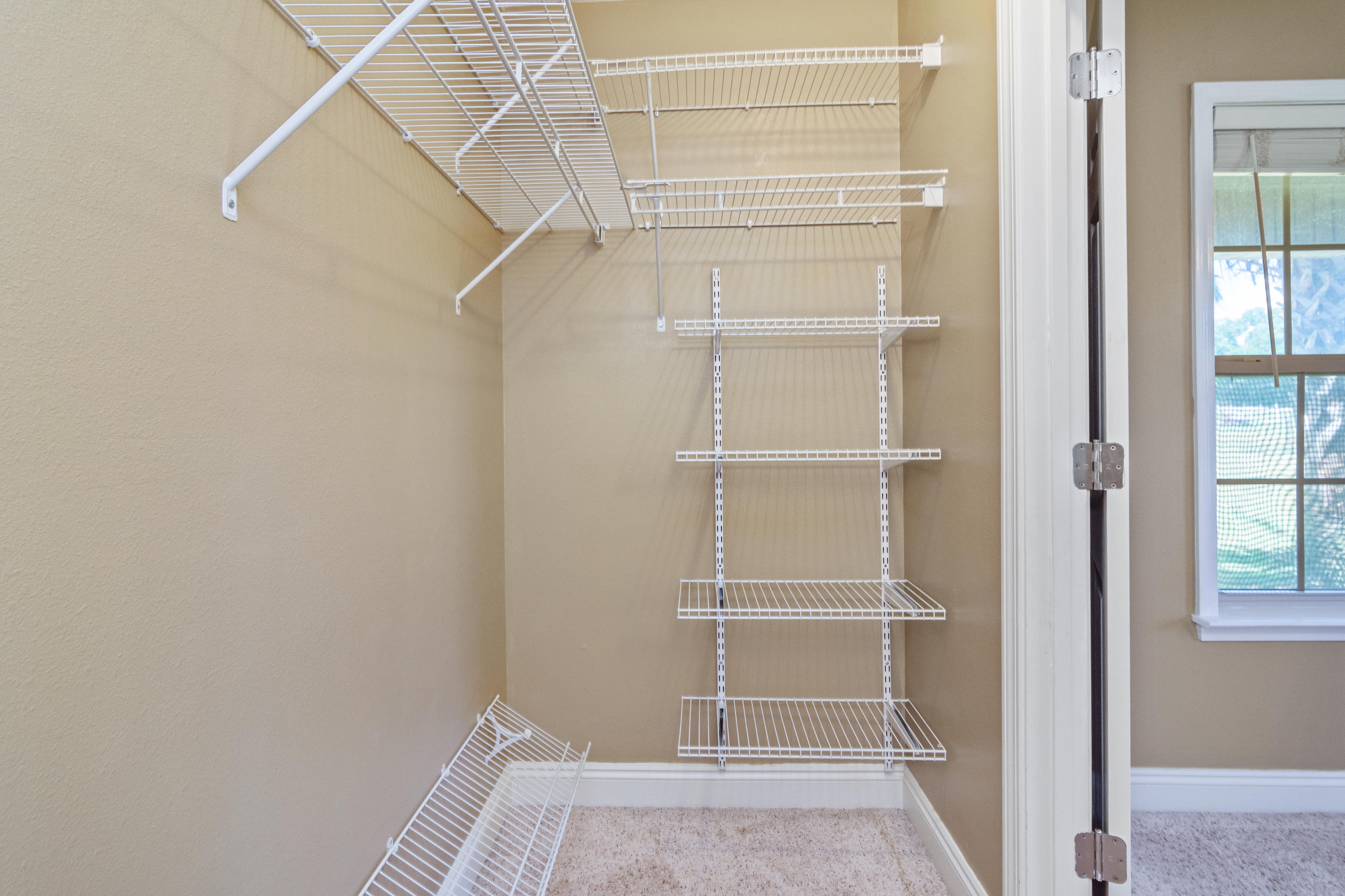 6589 Old River Road Baker, FL 32531 - Photo 25 of 49 a view of an empty walk in closet