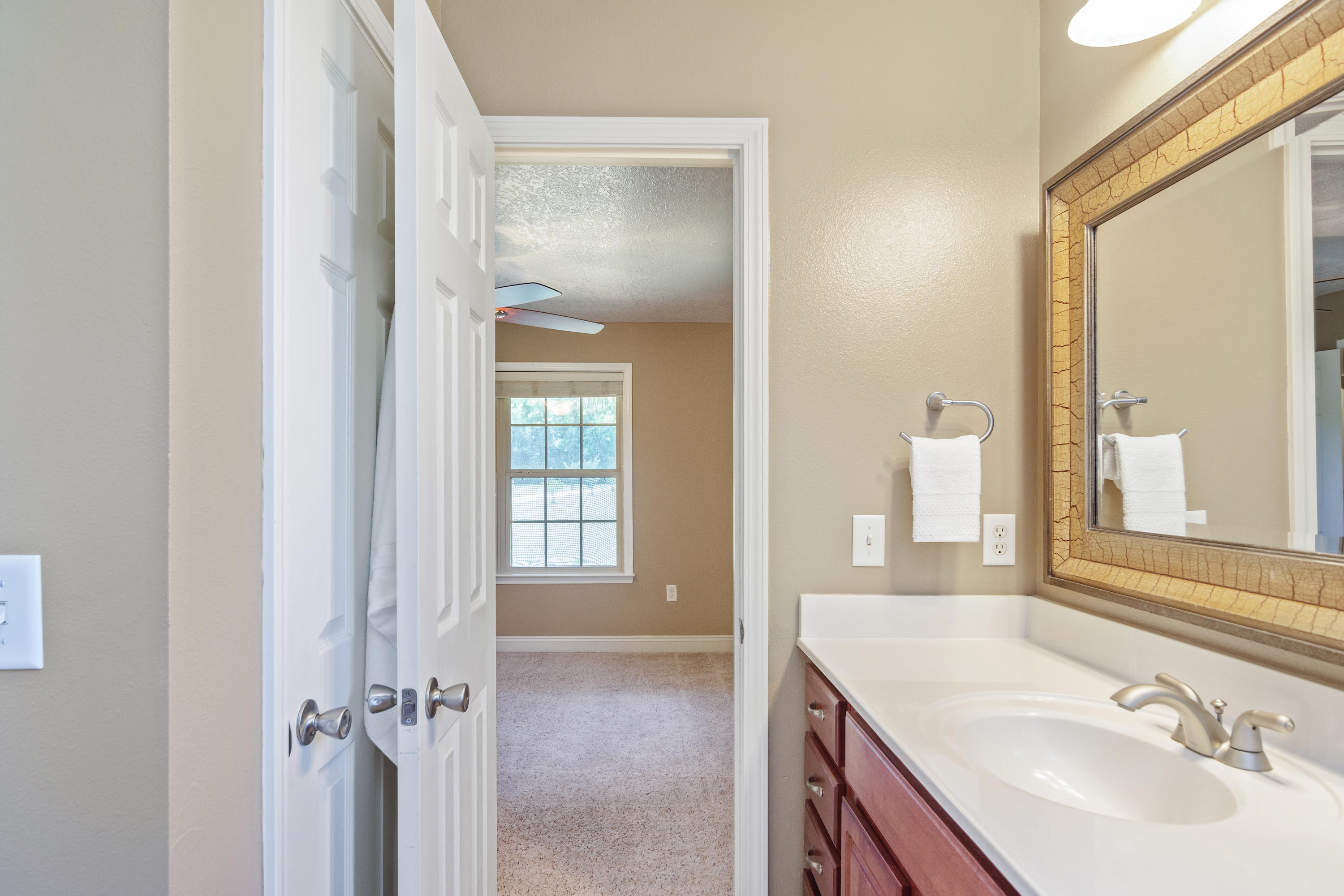 6589 Old River Road Baker, FL 32531 - Photo 27 of 49 a bathroom with a sink and a mirror