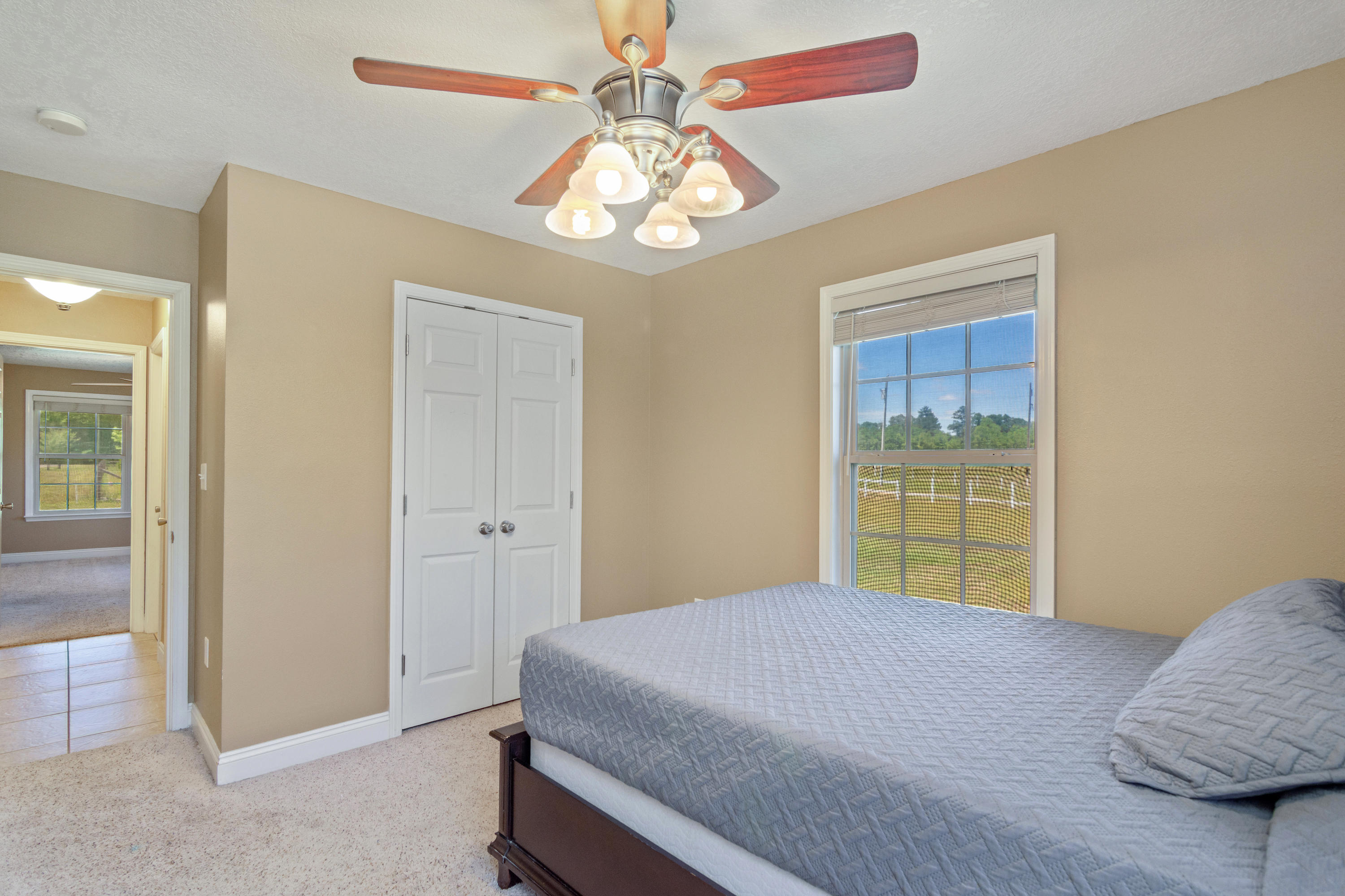 6589 Old River Road Baker, FL 32531 - Photo 29 of 49 a bedroom with a bed and a window