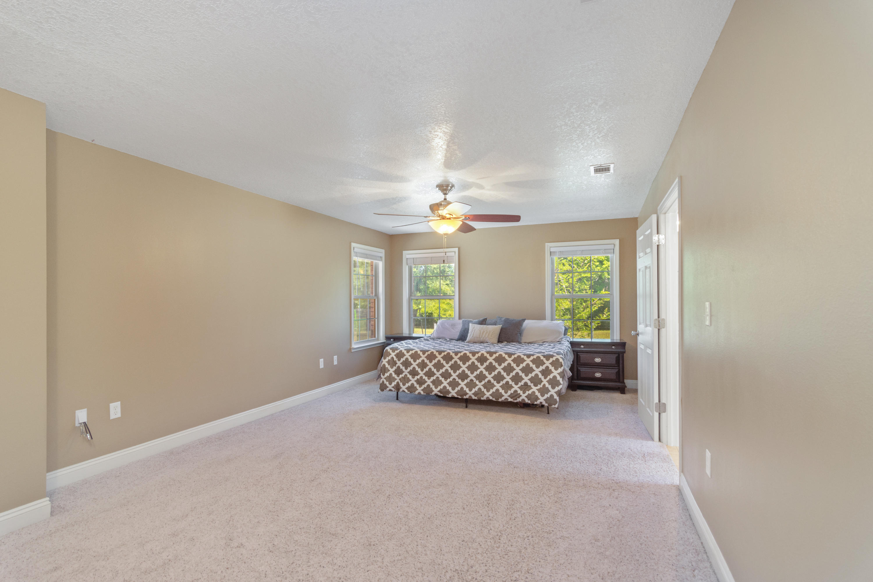 6589 Old River Road Baker, FL 32531 - Photo 30 of 49 a living room with furniture and a chandelier