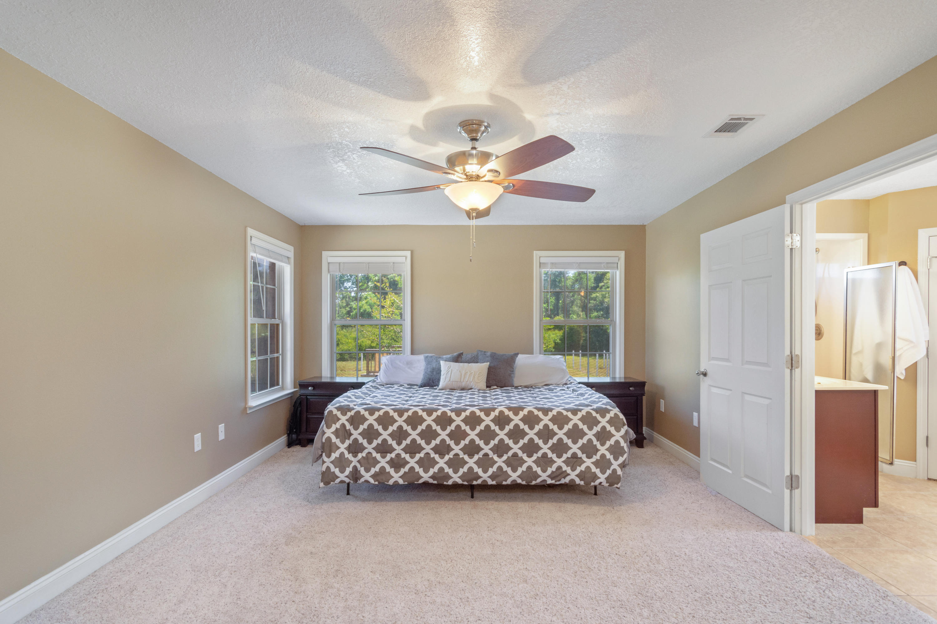 6589 Old River Road Baker, FL 32531 - Photo 31 of 49 a bedroom with a bed and window
