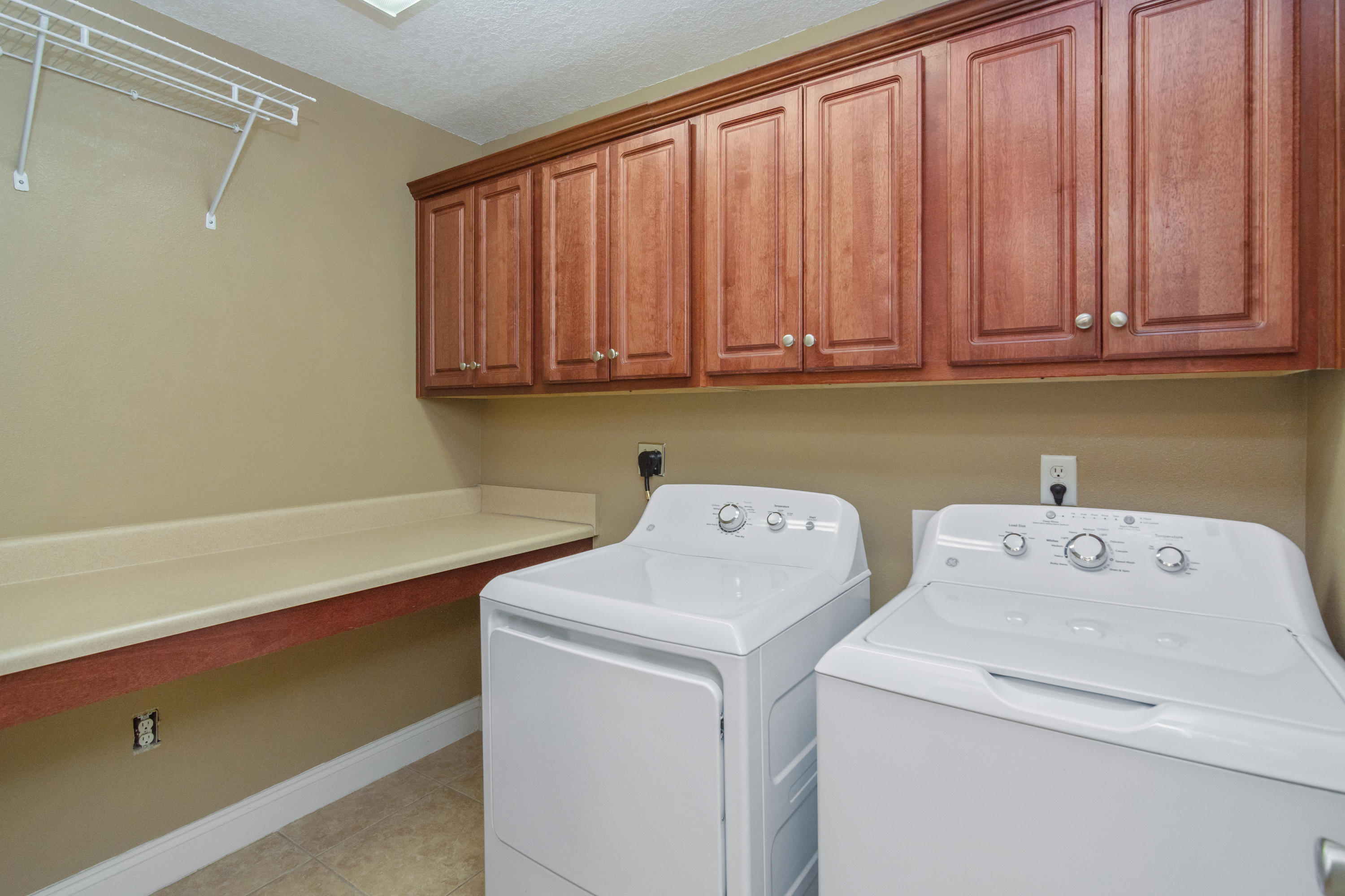 6589 Old River Road Baker, FL 32531 - Photo 37 of 49 a utility room with dryer and washer