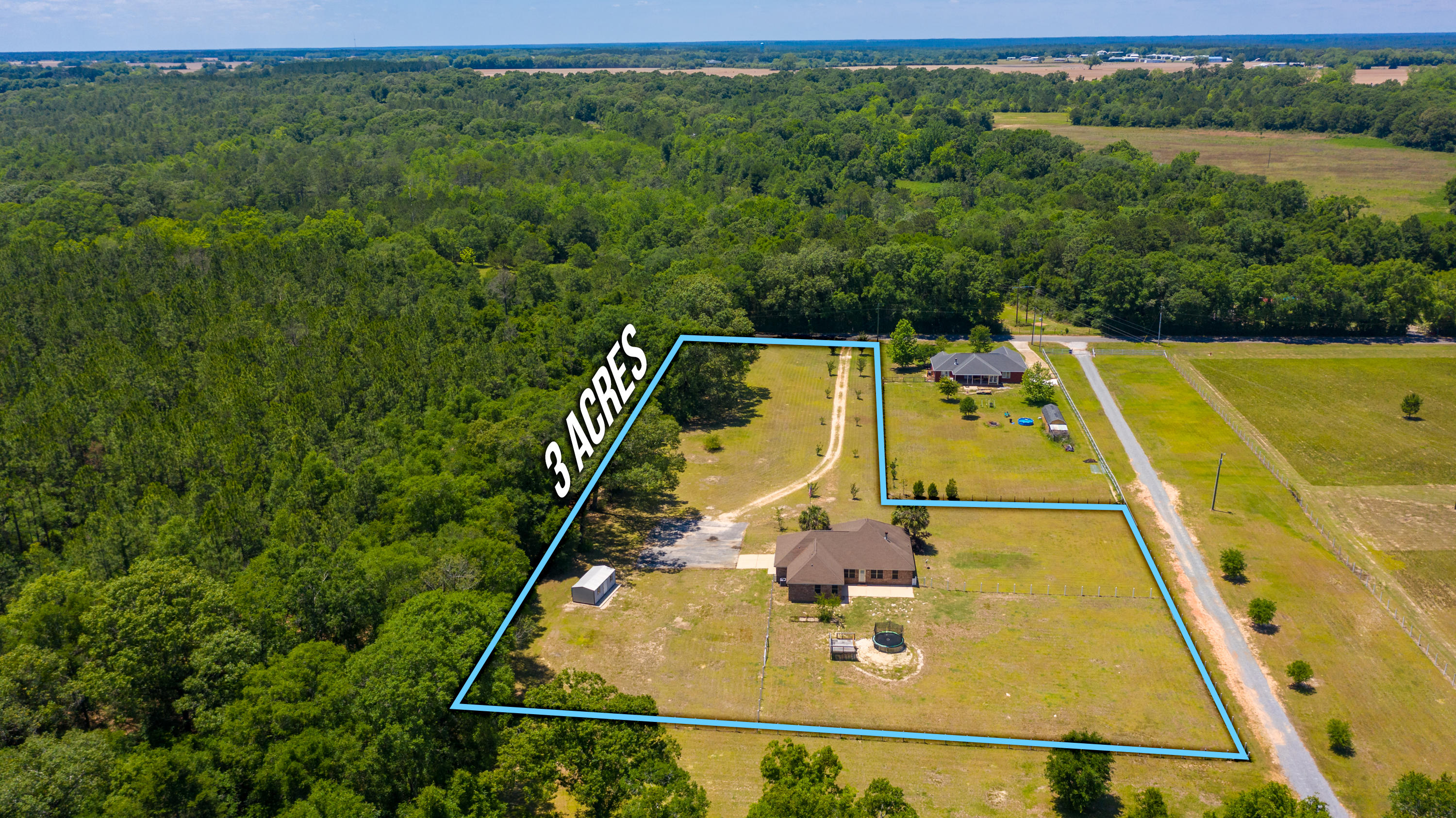 6589 Old River Road Baker, FL 32531 - Photo 4 of 49 a view of a swimming pool with a yard