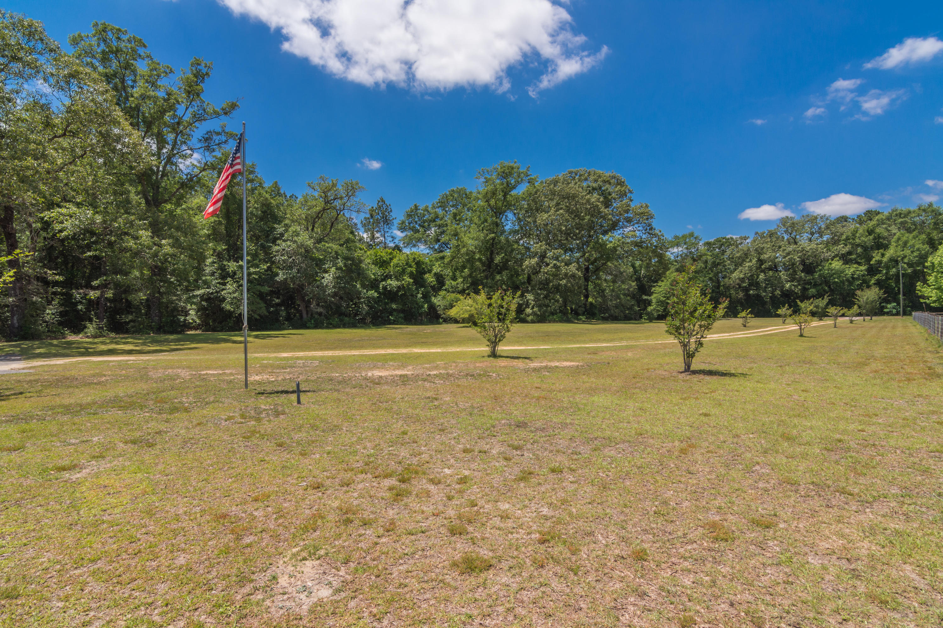 6589 Old River Road Baker, FL 32531 - Photo 44 of 49 a view of a playground with basketball court