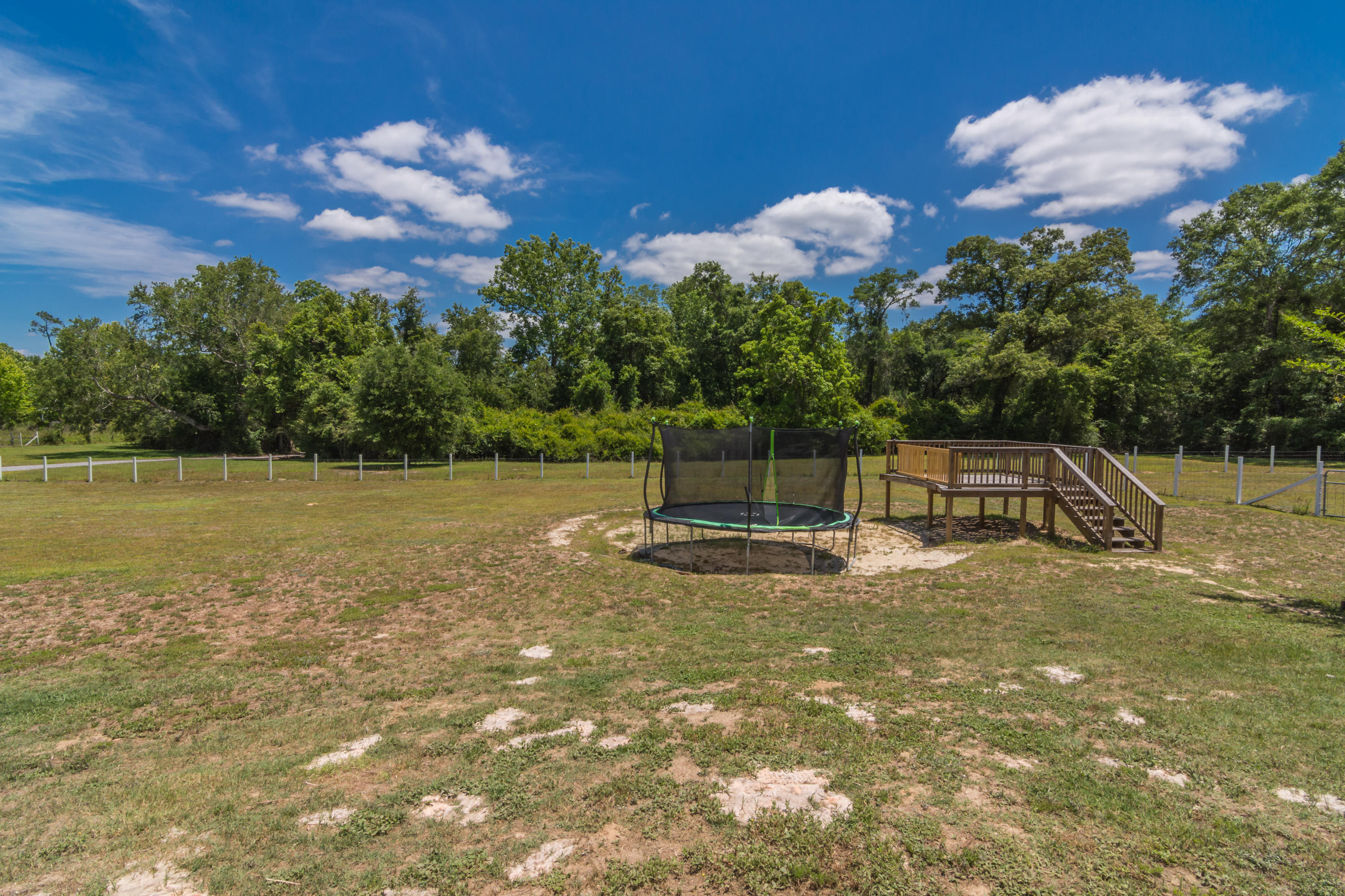 6589 Old River Road Baker, FL 32531 - Photo 45 of 49 a backyard of a house with lots of green space