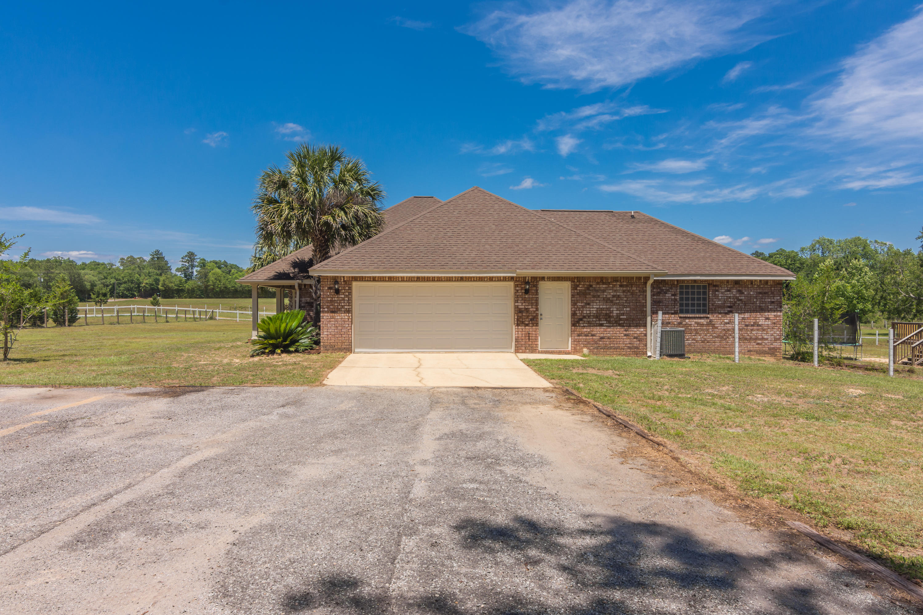 6589 Old River Road Baker, FL 32531 - Photo 8 of 49 a front view of a house with garden