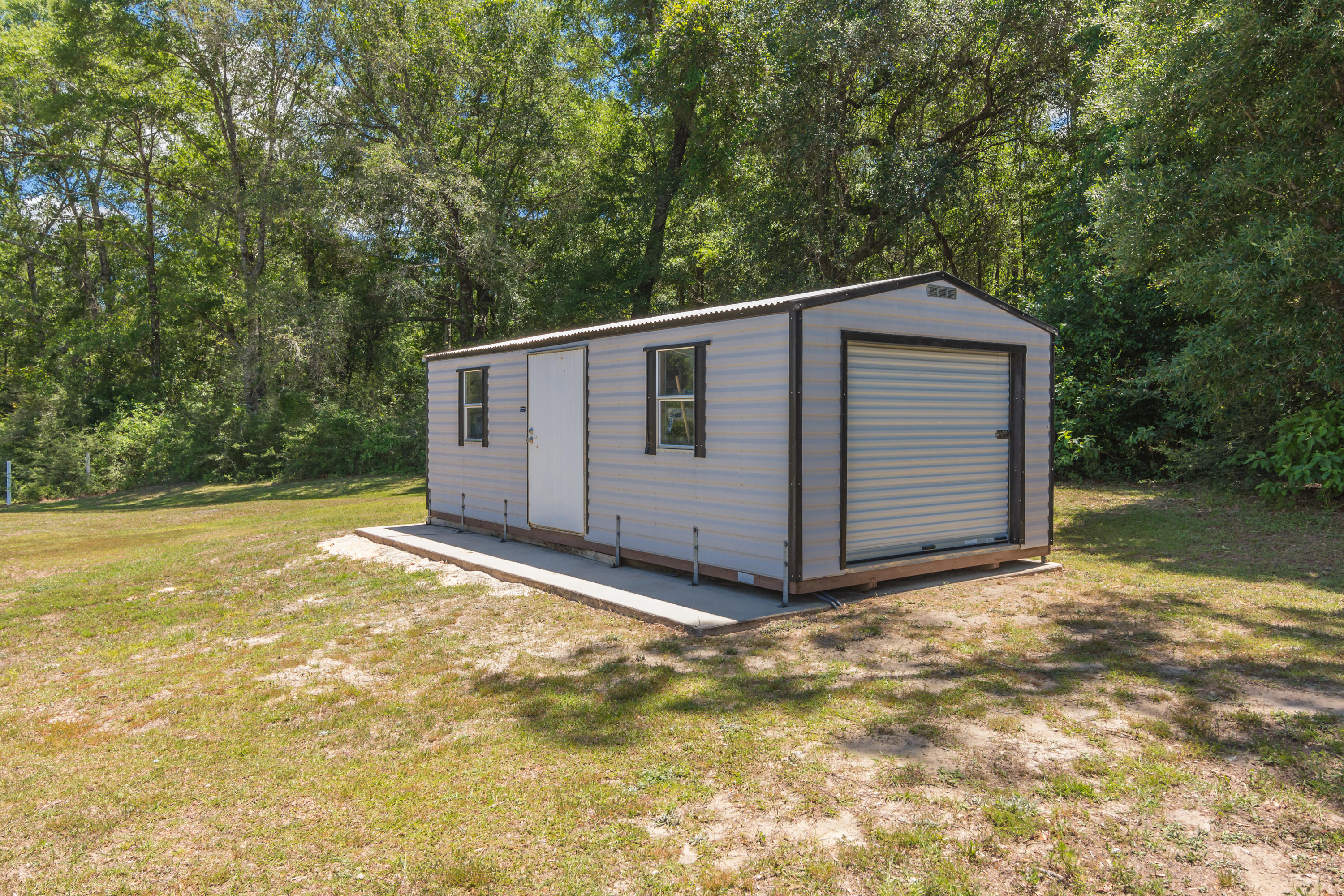 6589 Old River Road Baker, FL 32531 - Photo 9 of 49 a view of backyard with wooden fence and large trees
