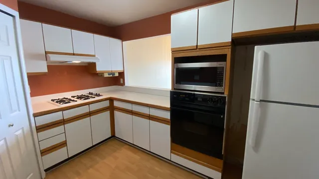 a kitchen with stainless steel appliances a sink and a refrigerator