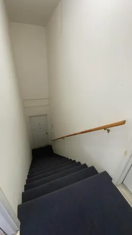 a view of a big yard next to a house with a yard