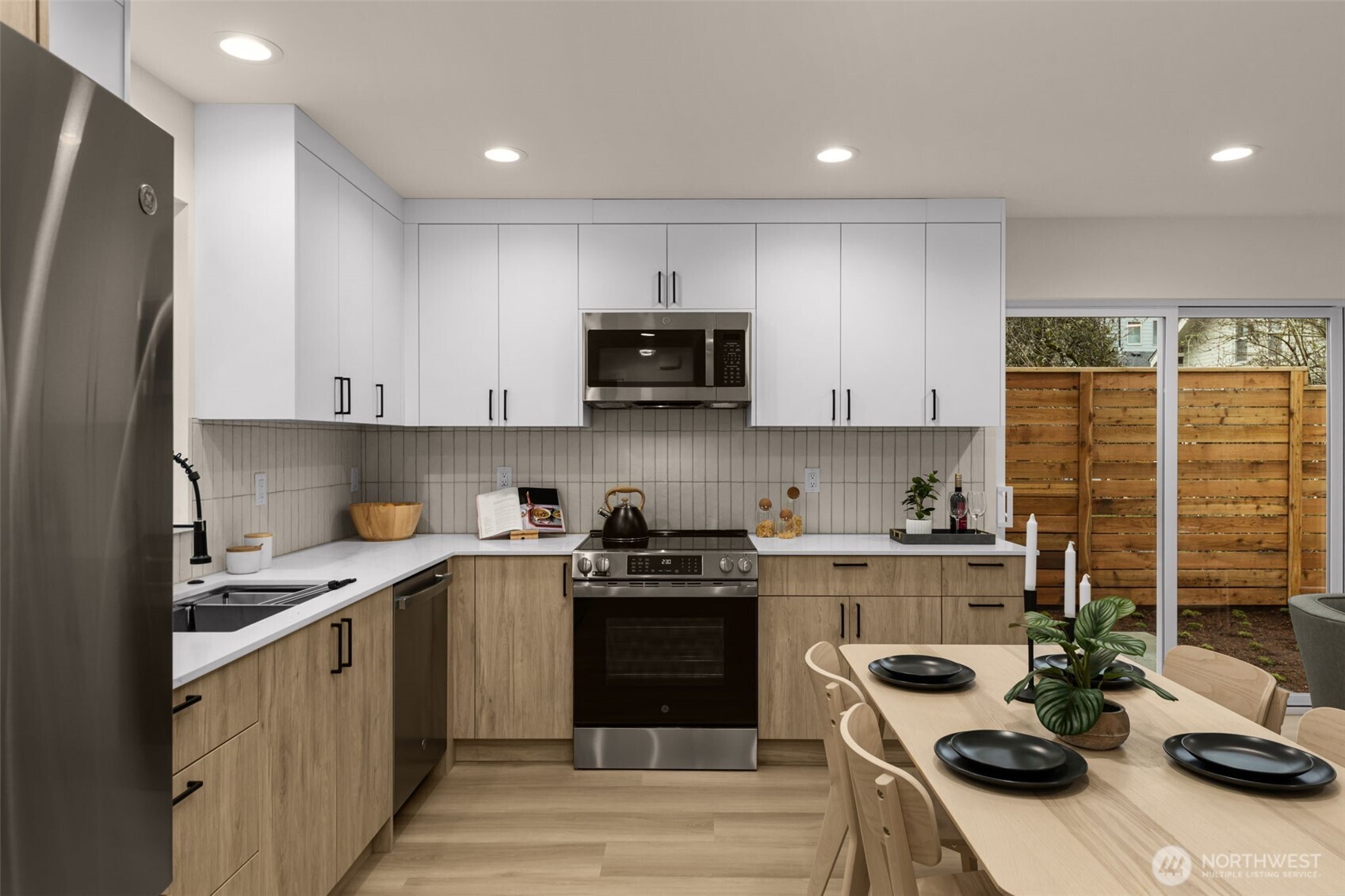 1109 26th Avenue South Seattle, WA 98144 - Photo 8 of 16 a kitchen with a sink a stove and cabinets