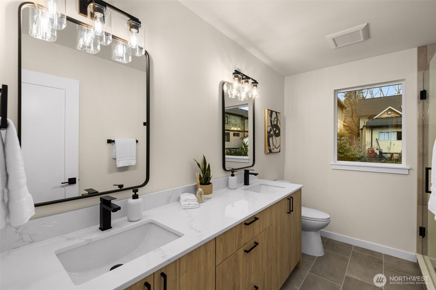 1109 26th Avenue South Seattle, WA 98144 - Photo 10 of 16 a bathroom with a double vanity sink and a mirror