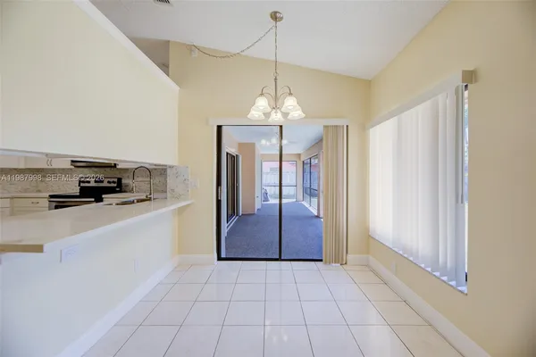 a kitchen with stainless steel appliances a refrigerator and a stove top oven