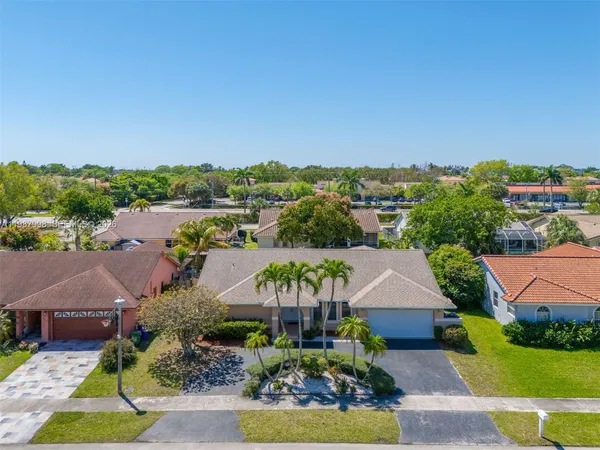 an aerial view of a house with a garden
